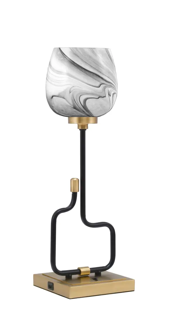 The Sandia Accent Lamp combines sophisticated mixed-metal finishes with practical USB charging ports. Its compact 20.5-inch height and striking onyx swirl glass shade make it perfect for bedside tables and desks.