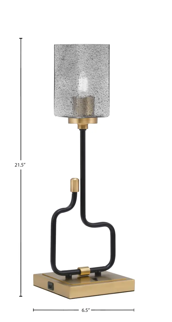 The Sandia Accent Lamp combines contemporary style with practical functionality. Its matte black and aged brass finish creates visual interest, while the smoke bubble glass shade adds texture and warmth. Built-in USB ports make it perfect for modern living. - alternate view