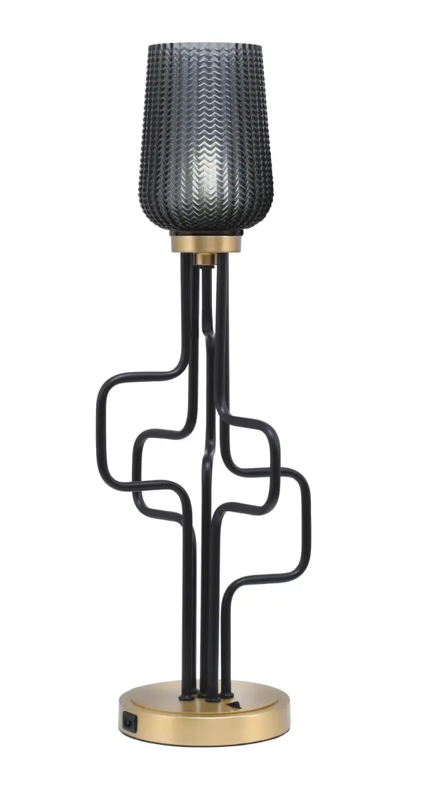The Sandia Accent Lamp blends industrial style with modern convenience, featuring a striking matte black and aged brass finish. The 5" smoke textured glass shade creates ambient lighting while built-in USB ports add practical functionality.