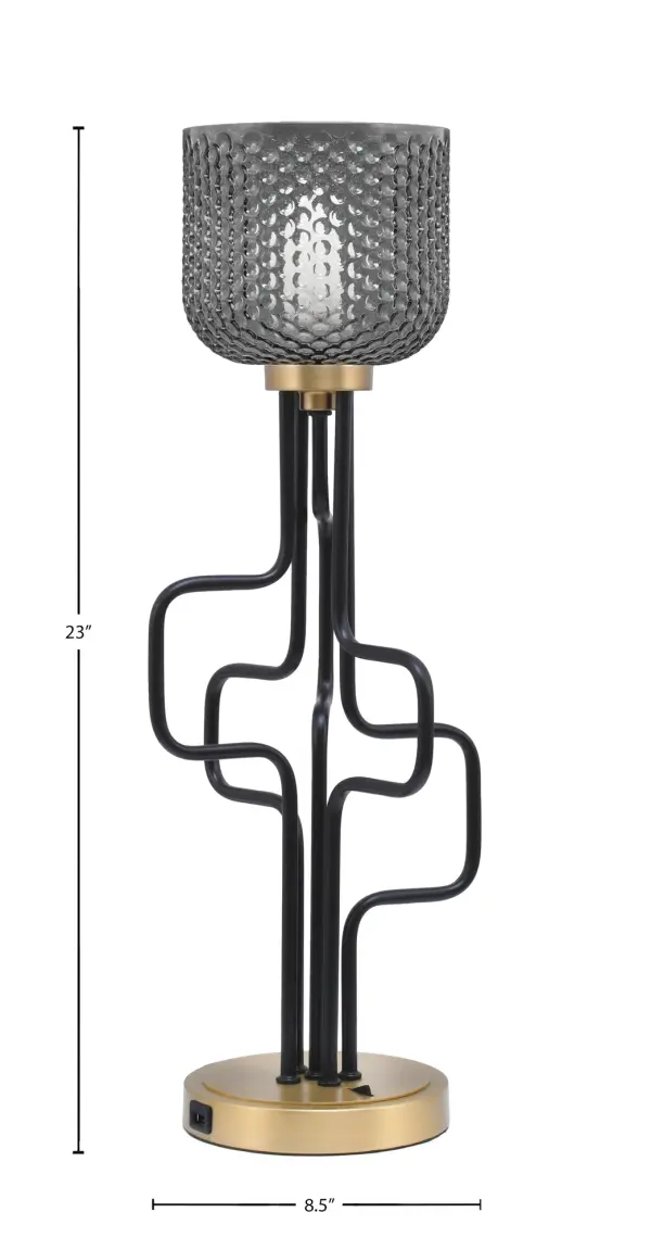 The Sandia Accent Lamp combines contemporary style with practical functionality. Featuring a striking matte black and aged brass finish with smoke textured glass, it includes built-in USB ports for device charging. - alternate view