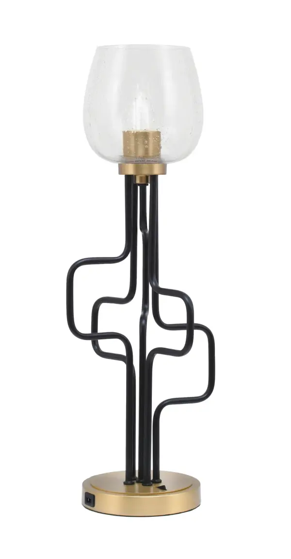 The Sandia Accent Lamp combines sophisticated mixed-metal finishes with practical USB charging ports. Its unique bubble glass shade creates ambient lighting while the compact footprint fits various spaces.