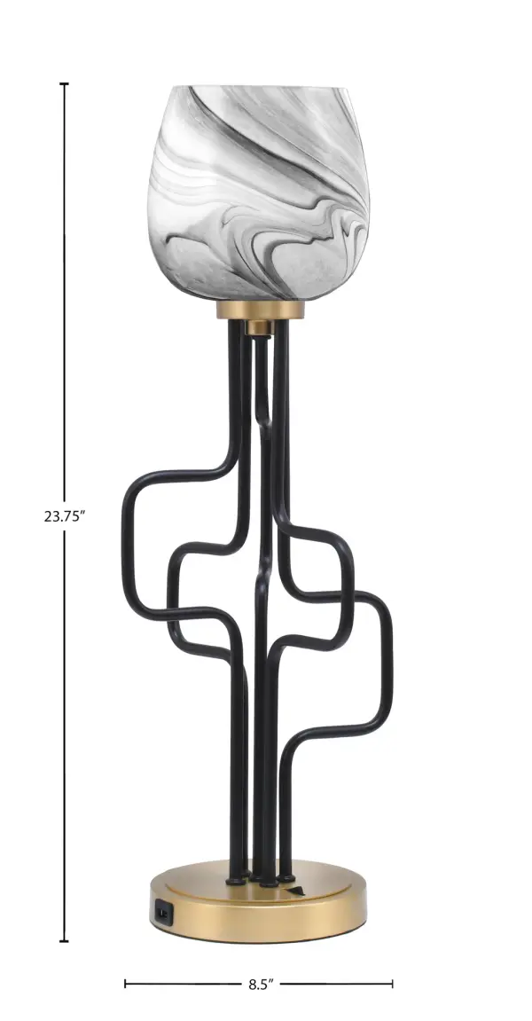 The Sandia Accent Lamp combines contemporary style with practical functionality. Its striking matte black and aged brass finish paired with a 6" onyx swirl glass shade creates sophisticated ambiance while built-in USB ports add modern convenience. - alternate view
