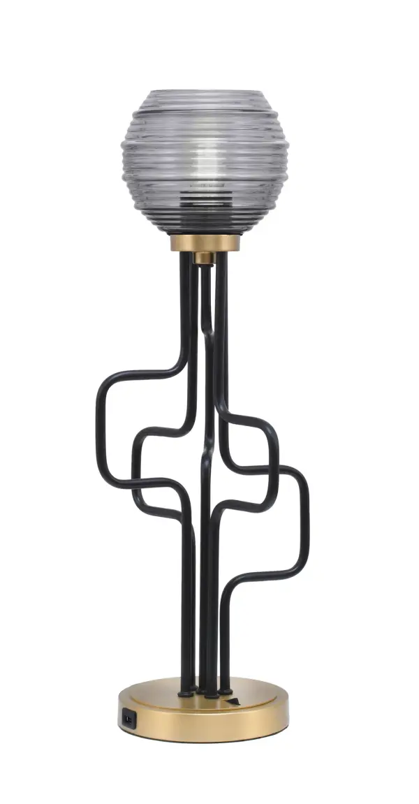 The Sandia Accent Lamp combines contemporary style with practical functionality. Its mixed metal finish and ribbed glass shade create visual interest while built-in USB ports add modern convenience for bedside or desk use.