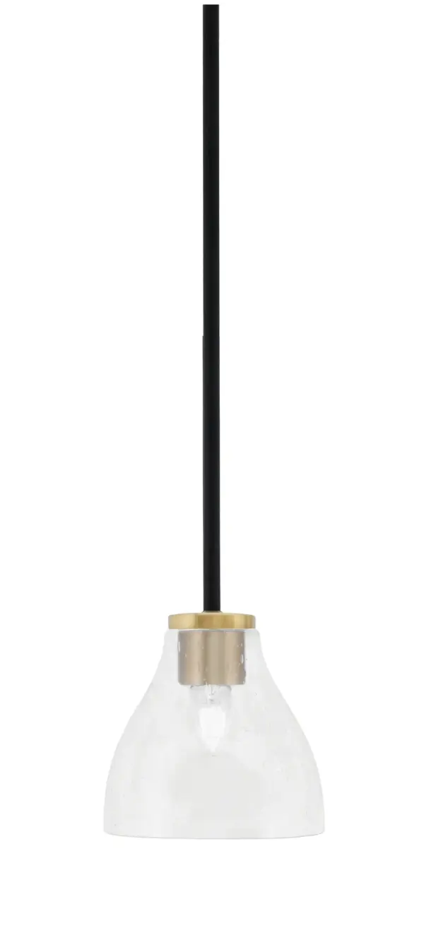 The Sandia mini pendant combines industrial charm with contemporary elegance through its two-tone matte black and aged brass finish. The 6.25" clear bubble glass shade adds textural interest while providing excellent light diffusion.