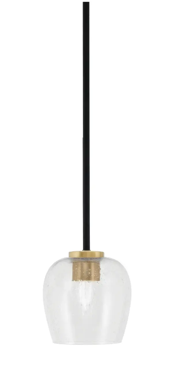 The Sandia mini pendant combines matte black and aged brass finishes with textured bubble glass for a sophisticated industrial-contemporary look. Its compact 6-inch size makes it ideal for smaller spaces or grouped installations.