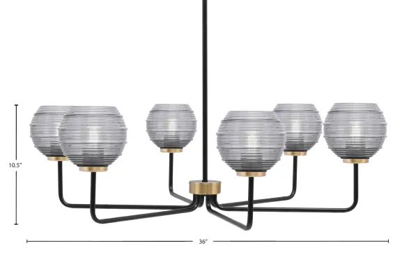 The Sandia 6-Light Chandelier combines matte black and new age brass finishes for a sophisticated modern aesthetic. Smoke ribbed glass shades create captivating light effects while diffusing a warm glow across your space. - alternate view