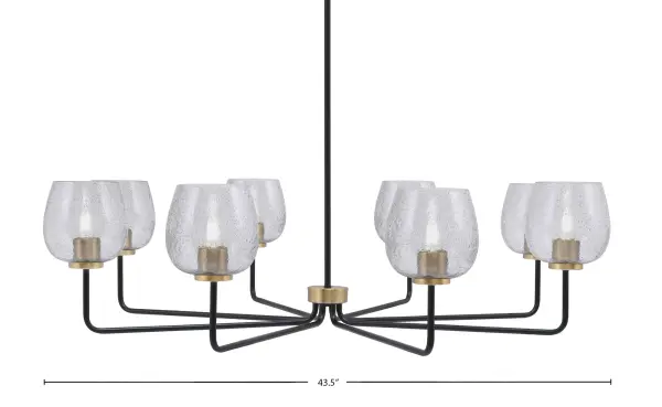 The Sandia 8-Light Chandelier makes a striking statement with its generous 43.5-inch span and distinctive smoke bubble glass shades. The mixed-metal finish of matte black and new age brass creates visual depth while the textured glass diffuses light beautifully.