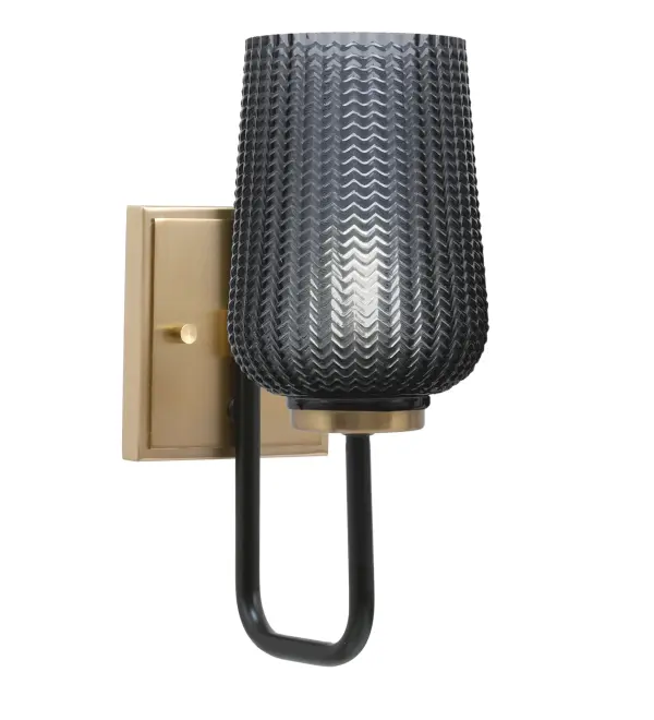 The Sandia Wall Sconce combines matte black and new age brass finishes with a distinctive smoke textured glass shade. Its compact 5-inch design and up/down mounting flexibility make it ideal for hallways, bathrooms, and living spaces.