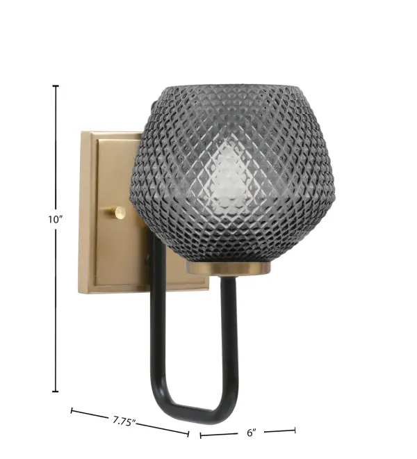 The Sandia Wall Sconce combines bold industrial design with refined finishes. Its striking matte black and new age brass pairing creates visual depth, while the smoke textured glass shade adds character and warmth to any space. - alternate view