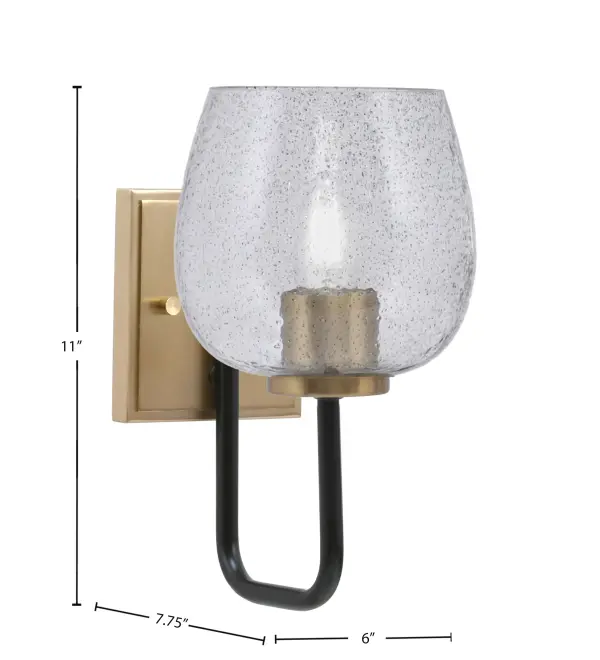 The Sandia Wall Sconce combines industrial style with modern sophistication through its two-tone Matte Black and New Age Brass finish. The 6-inch Smoke Bubble Glass shade creates ambient lighting with textured visual interest. - alternate view