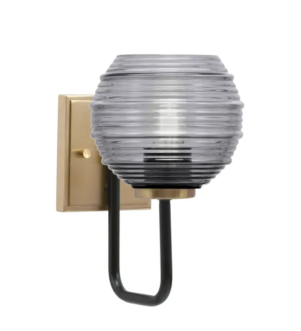 The Sandia Wall Sconce combines matte black and brass finishes with distinctive smoke ribbed glass for a contemporary look. Its compact 6-inch width and up/down mounting flexibility make it ideal for bathrooms, hallways, and accent lighting.