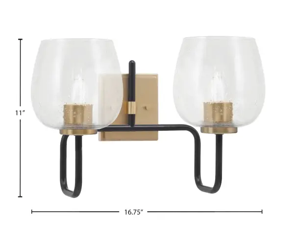 The Sandia 2-Light Bath Bar combines contemporary styling with industrial flair through its striking matte black and brass finish pairing. Clear bubble glass shades add textural interest while providing excellent illumination for bathroom tasks. - alternate view