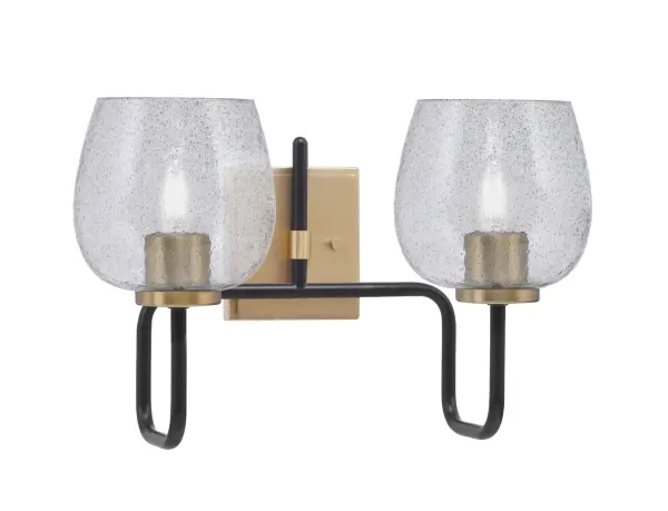 The Sandia 2-Light Bath Bar combines contemporary style with versatile functionality. Its striking matte black and brass finish paired with smoke bubble glass creates sophisticated ambiance while providing ample task lighting.
