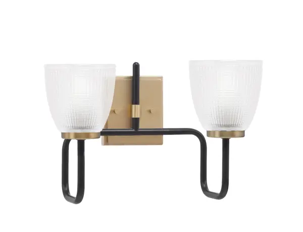 The Sandia 2 Light Bath Bar combines Matte Black and New Age Brass finishes for a sophisticated look. Clear ribbed glass shades provide beautiful light diffusion, perfect for modern and transitional bathrooms.