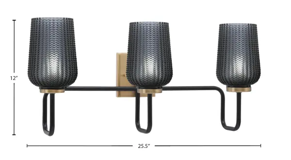 The Sandia 3-Light Bath Bar combines contemporary design with industrial flair. Its mixed metal finish of matte black and new age brass creates visual interest, while smoke textured glass shades provide soft, diffused lighting perfect for bathroom vanities. - alternate view