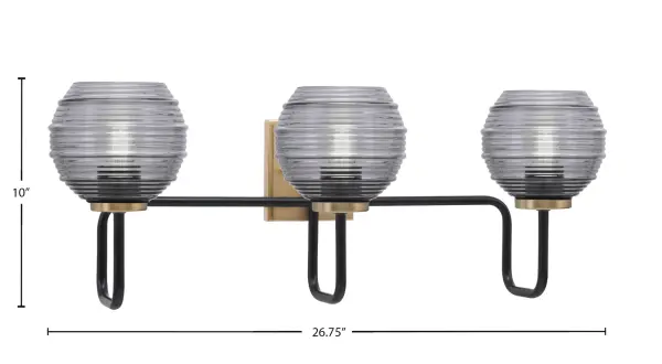 The Sandia 3 Light Bath Bar combines sophisticated matte black and brass finishes with smoke ribbed glass shades for a contemporary look. At 26.75" wide, it provides ample lighting for medium to large vanities while adding visual interest. - alternate view