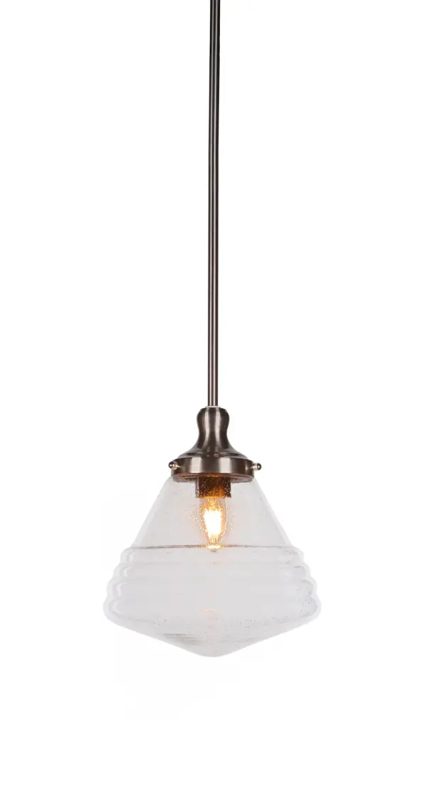 The Juno pendant combines a sleek brushed nickel finish with eye-catching clear bubble glass for a contemporary look that works in multiple settings. Its adjustable stem system and compact 10-inch diameter make it ideal for kitchen islands, dining areas, and smaller spaces.