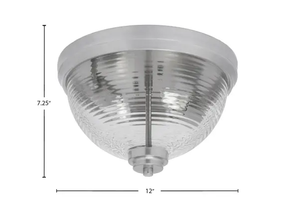 This 12-inch flush mount combines contemporary styling with practical functionality. The brushed nickel finish offers a sophisticated, neutral aesthetic while the clear ribbed glass creates visual interest through textured light diffusion. - alternate view