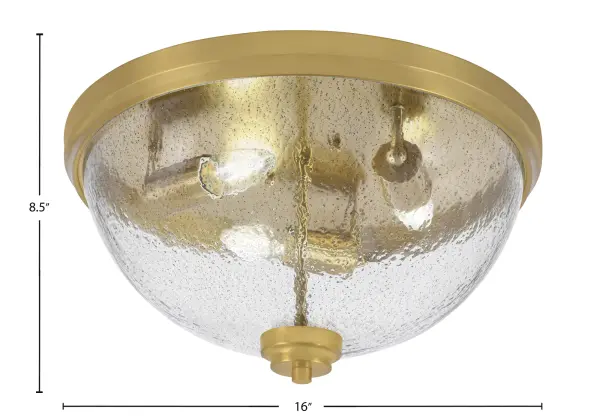 This 16-inch flush mount combines contemporary style with industrial charm through its New Age Brass finish and unique smoke bubble glass. Perfect for rooms with lower ceilings, it provides ample illumination with three bulbs while maintaining a low 8.5-inch profile. - alternate view