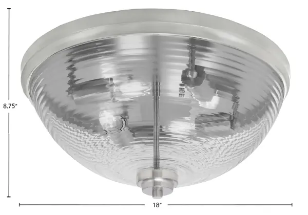 This 18-inch flush mount combines a sleek brushed nickel finish with distinctive ribbed glass for a sophisticated lighting solution. The four-bulb configuration provides ample illumination while the low-profile design works well in rooms with standard ceiling heights. - alternate view