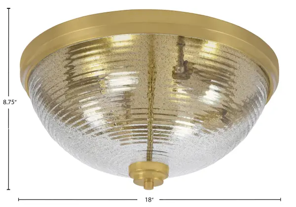 This 18" flush mount combines modern sophistication with transitional appeal through its New Age Brass finish and distinctive smoke ribbed glass. The textured shade creates dynamic light patterns while the low-profile design suits standard ceiling heights. - alternate view