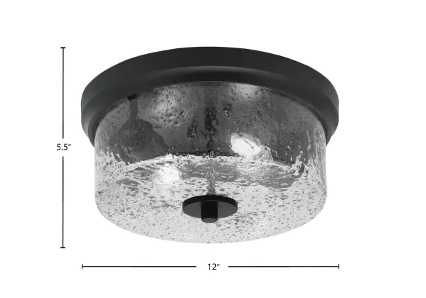 This 12-inch flush mount combines contemporary style with practical functionality. The matte black finish and unique smoke bubble glass create visual interest while the low-profile design works perfectly in spaces with standard ceiling heights. - alternate view