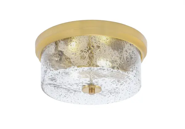 This 12-inch flush mount combines warm New Age Brass finish with distinctive smoke bubble glass for a modern, sophisticated look. Perfect for low-ceiling spaces requiring both style and function.