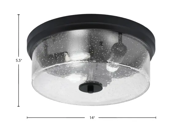 This 14-inch flush mount combines industrial style with vintage charm through its textured bubble glass and matte black finish. Perfect for low-ceiling spaces, it provides excellent light diffusion while making a design statement. - alternate view