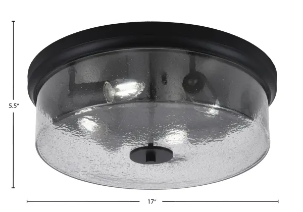 This 17-inch flush mount combines industrial charm with contemporary appeal through its matte black finish and unique smoke bubble glass. Perfect for spaces with lower ceilings, it provides ample illumination with four bulbs. - alternate view