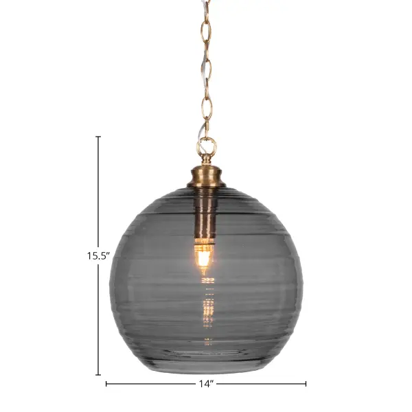 The Malena pendant combines warm New Age Brass finish with a striking 14" smoke ribbed glass shade. Its adjustable chain allows versatile installation heights, while the textured glass creates ambient lighting perfect for modern spaces. - alternate view