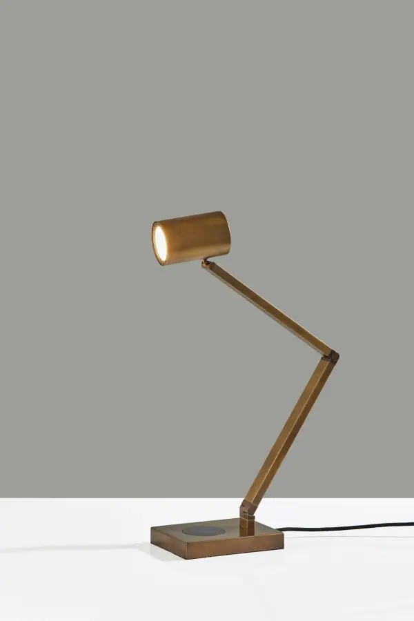 The Newman Task Lamp combines industrial styling with modern functionality. Features adjustable 3-point positioning, integrated 10W LED, 4-way touch dimming, Qi wireless charging pad, and USB port for simultaneous device charging.