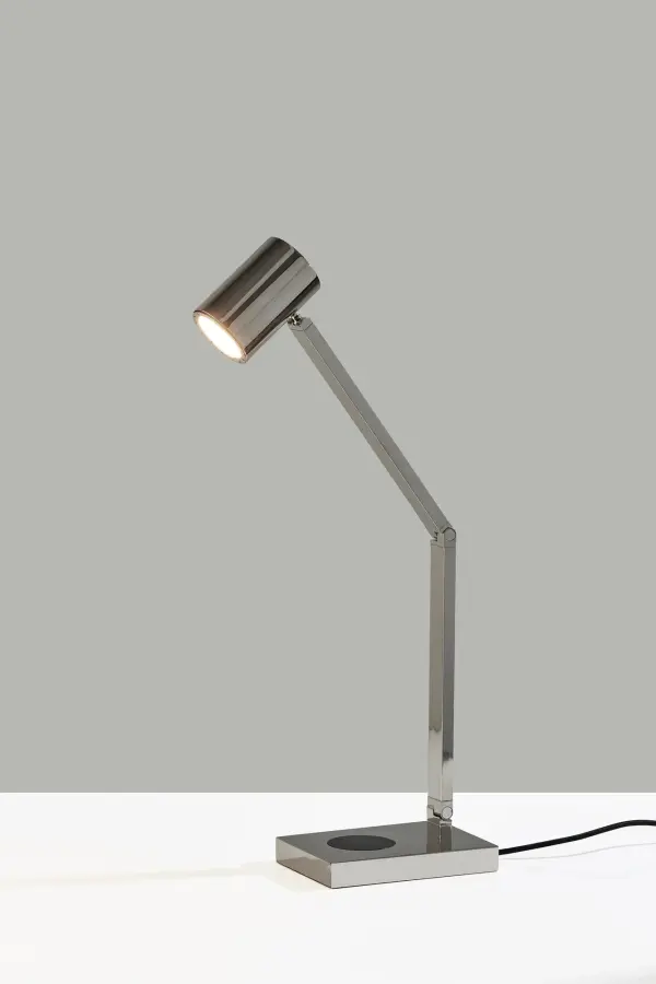 The Newman Task Lamp combines sleek industrial design with modern functionality. Features 3-point adjustability, integrated 10W LED, 4-way touch dimming, wireless Qi charging pad, and USB port for simultaneous device charging.