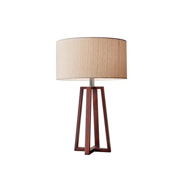 The Quinn table lamp blends vintage-inspired design with contemporary convenience. Its crisscross walnut birch base and natural linen shade create warm, textural appeal, while the 3-way switch offers lighting flexibility.