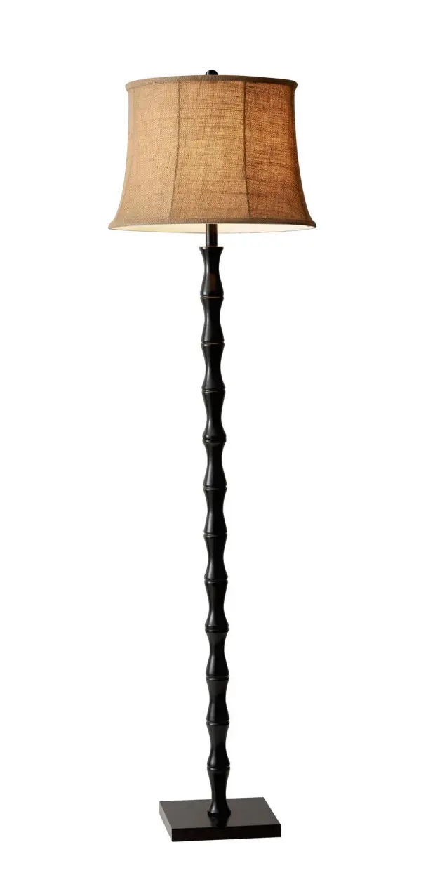 The Stratton floor lamp combines traditional craftsmanship with contemporary simplicity. Its painted black metal pole features a carved wood motif, while the medium brown burlap shade adds warmth to any space.