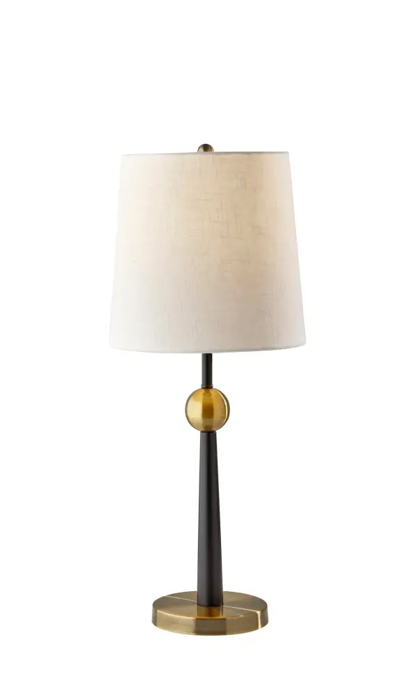 The Francis Table Lamp combines mid-century design with contemporary elegance through its distinctive black and antique brass finish. At 29 inches tall with a textured off-white fabric shade, it provides ample ambient lighting while serving as a striking decorative accent.