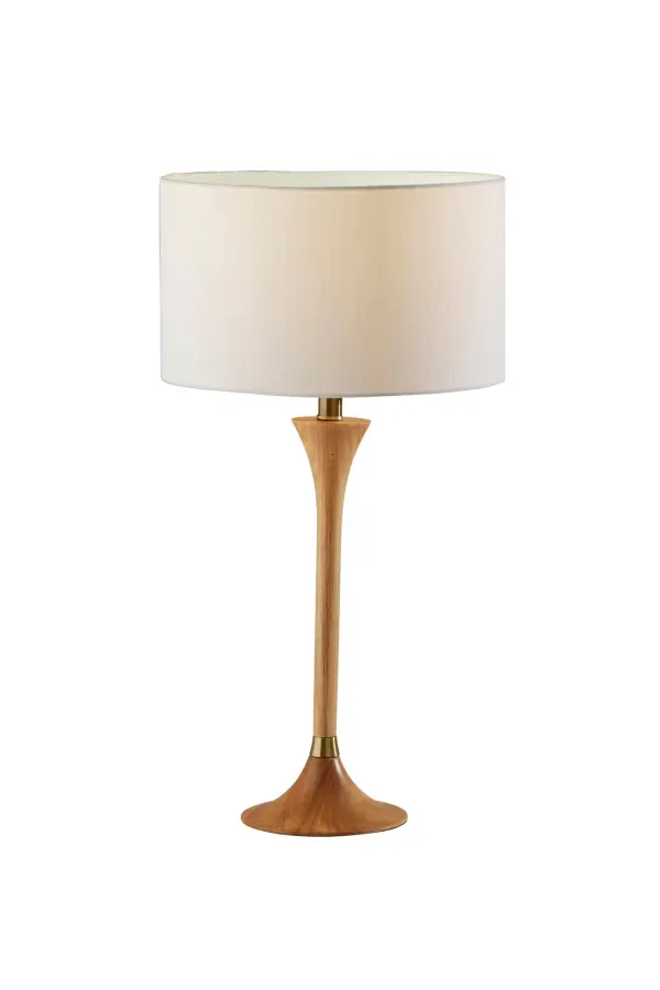 The Rebecca table lamp combines natural rubberwood with antique brass accents for a sophisticated transitional look. Its tapered stem design and white textured drum shade create soft, diffused lighting perfect for bedrooms and living spaces.