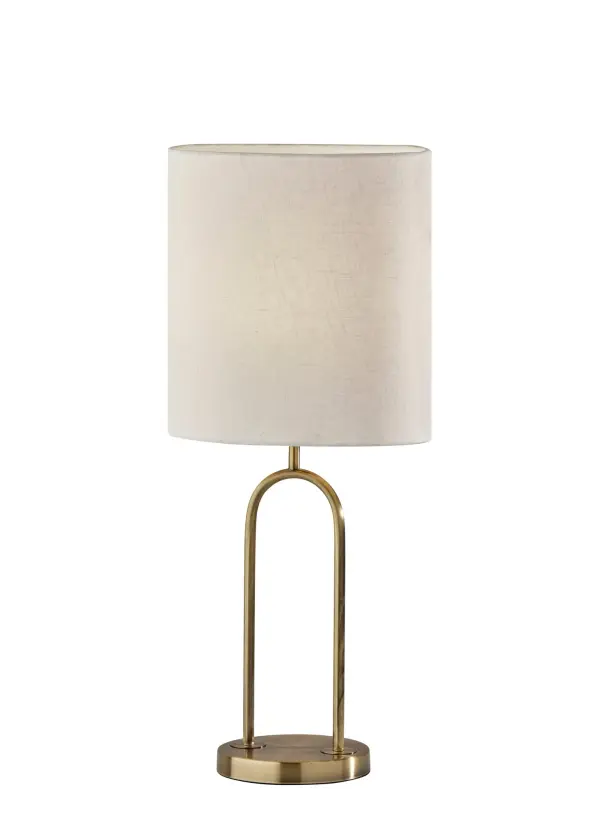 The Joey table lamp combines modern minimalism with warm metallic tones through its unique arc design and antique brass finish. At 28.5" tall, it provides substantial presence while the off-white textured shade softly diffuses light.