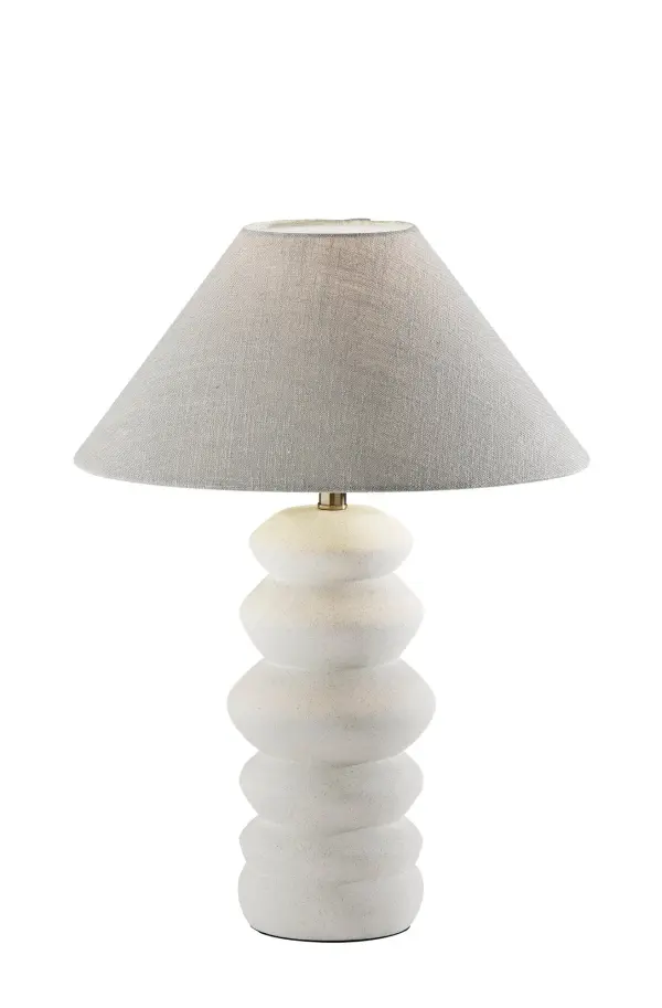 The Marcey Table Lamp combines a sleek matte off-white ceramic base with a tapered taupe textured fabric shade, creating a sophisticated contemporary accent. At 25 inches tall, it provides versatile lighting for bedrooms, living spaces, and offices.