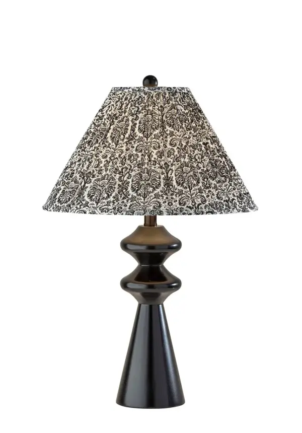 This table lamp features a turned wood-look base topped with a colorful pleated floral shade for a cheerful, collected look. The traditional silhouette feels familiar, while the vibrant print gives the piece a playful, eclectic twist. It adds personality and warmth to bedrooms, reading nooks, and accent tables. Collection: Dahlia Finish: Black Glass: Soft Pleated Navy/White Printed Fabric Width: 17.00" Height: 26.50" Length: 17.00" Weight: 7.90 lb Extension from Wall: 17.00" Wire: 60" Black Maximum Wattage: 100.00 W Bulb Base: E26 Material: Wood:50%, Metal:10%, Fabric:30%, Electrical parts:10% Country of Origin: Cambodia Safety Listing: ETL Switch: Rotary Socket Switch