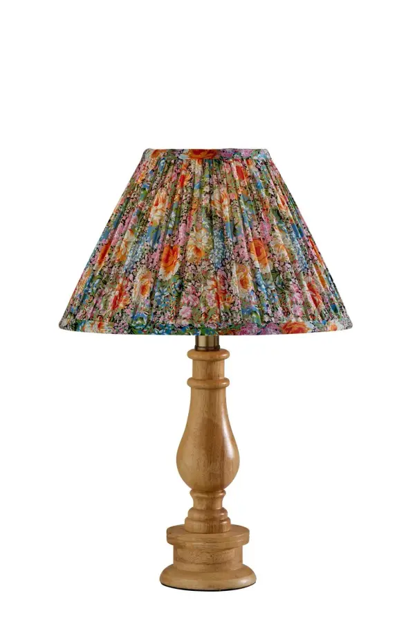 This compact cordless lamp features a slim metal stem, conical metal shade, and white wood-look base for a clean, decorative look. The mixed-material design feels modern yet approachable, making it an easy accent for bookshelves, desks, and bedside tables. Its portable size lets you place light where you need it most. Collection: Faye Finish: Natural Wood Glass: Soft Pleated Multi-color Floral Printed Fabric Width: 12.00" Height: 18.00" Length: 12.00" Weight: 4.47 lb Extension from Wall: 12.00" Wire: 60" Clear Maximum Wattage: 60.00 W Bulb Base: E26 Material: Wood:50%, Metal:10%, Fabric:30%, Electrical parts:10% Country of Origin: Cambodia Safety Listing: ETL Switch: Rotary Socket Switch