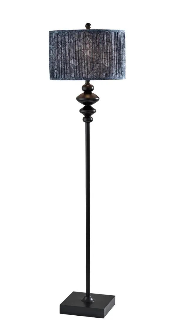Samira Floor Lamp in Black pairs a black finish a soft pleated blue printed fabric for a warm, styled glow. Sized at H: 61", W: 16", D: 16" with a 9.759.75" base and a rotary socket switch. Uses E26 bulb base (max 100W/16W). Collection: Samira Finish: Black Glass: Soft Pleated Blue Printed Fabric Width: 16.00" Height: 61.00" Length: 16.00" Weight: 14.80 lb Extension from Wall: 16.00" Wire: 60" Black Maximum Wattage: 100.00 W Bulb Base: E26 Material: Polyresin:50%, Metal:10%, Fabric:30%, Electrical parts:10% Country of Origin: Cambodia Safety Listing: ETL Switch: Rotary Socket Switch
