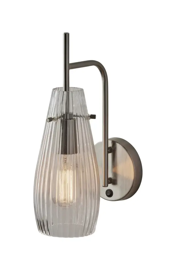 The Layla wall lamp combines mid-century modern aesthetics with vintage charm through its slender brushed steel frame and distinctive ribbed glass shade. Perfect for symmetrical placement flanking beds or mirrors, or as standalone accent lighting in entryways and hallways.