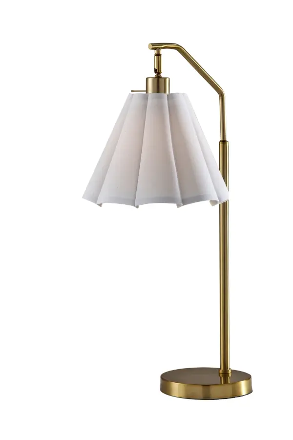 The Lyra Table Lamp combines classic antique brass styling with a sophisticated scalloped white fabric shade. At 26 inches tall, it delivers warm, diffused lighting perfect for creating inviting atmospheres in bedrooms and living spaces.