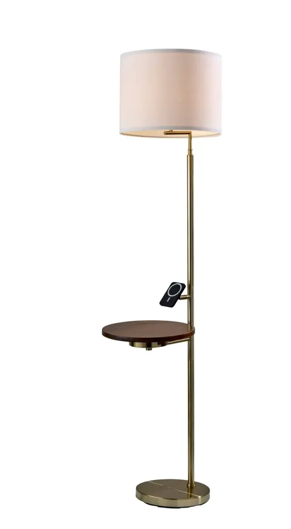 Joel Wireless Charging Task Floor Lamp w. Table in Antique Brass pairs a antique brass finish a metal for a warm, styled glow. Sized at H: 56", W: 12", D: 17" with a 10" Dia. base and a rotary socket switch. Convenient charging is built in: 2.1A USB-A & USB-C CHARGING PORTS Mag Safe 20W WIRELESS CHARGER AC OUTLET. Collection: Wyatt Finish: Antique Brass Glass: Metal Width: 12.00" Height: 56.00" Length: 17.00" Weight: 16.28 lb Extension from Wall: 17.00" Wire: 144" Clear Maximum Wattage: 60.00 W Bulb Base: E26 Light Source: Incandescant Material: Metal 45% Wood 15% Plastic 25% Packing - 15% Country of Origin: Vietnam Safety Listing: UL Switch: Rotary Socket Switch