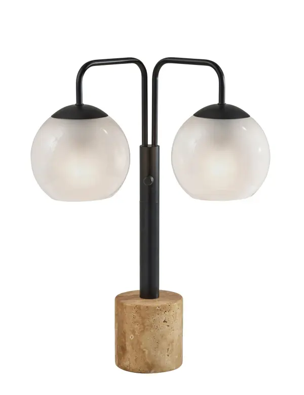 The Stockton Table Lamp combines contemporary design with natural materials, featuring two glossy black globe shades and a striking travertine stone base. Its 3-way rotary switch offers versatile lighting control.