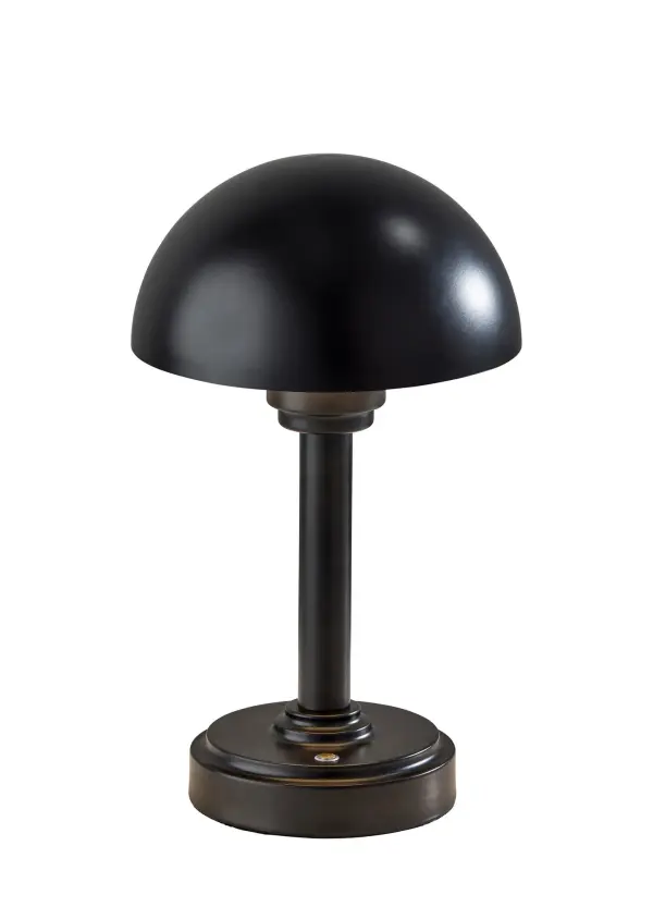 The Ollie LED Cordless Table Lamp combines mid-century modern aesthetics with modern rechargeable technology. Its compact 10.75" design features a sleek dome shade and wood base, offering up to 16 hours of cordless illumination with 3-level touch control for versatile accent lighting anywhere.