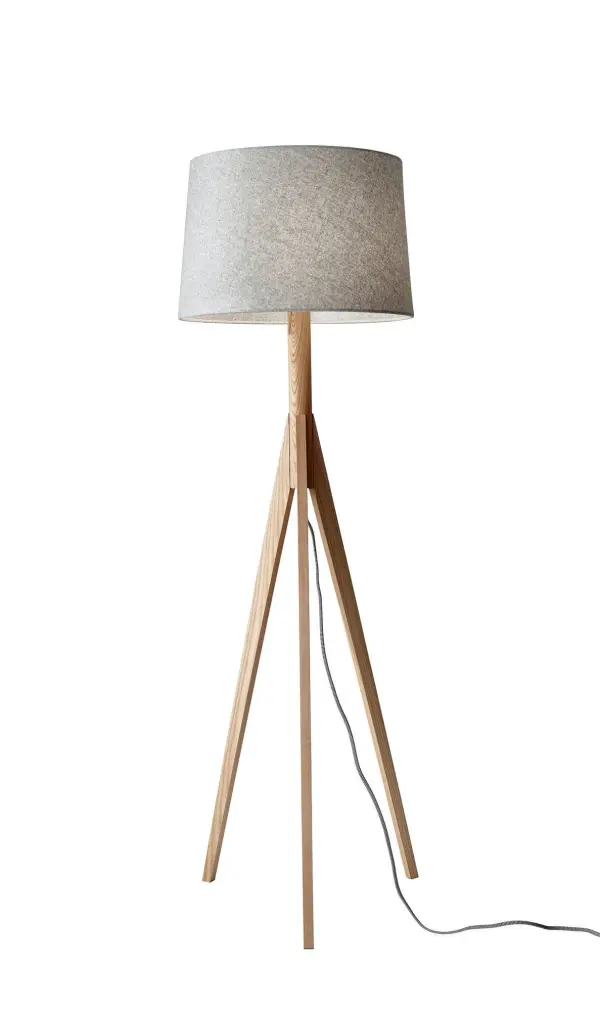 The Eden Floor Lamp combines natural ash wood with a textured grey felt shade for a warm, modern aesthetic. Its tripod base and 3-way switch offer both style and functionality, perfect for contemporary spaces.