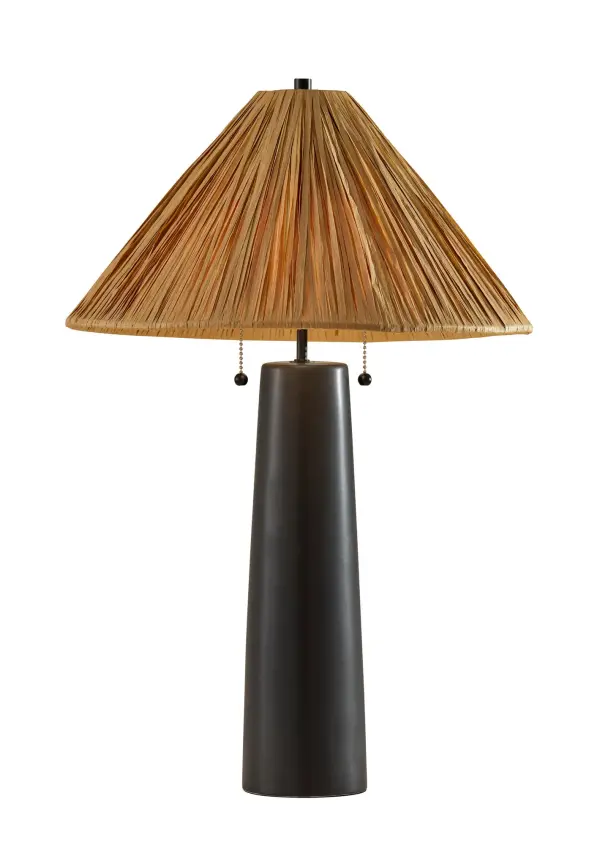 The Waylon Table Lamp blends contemporary black ceramic with organic raffia grass for a sophisticated yet natural aesthetic. Its dual pull chain switches and warm ambient lighting make it both functional and stylish.