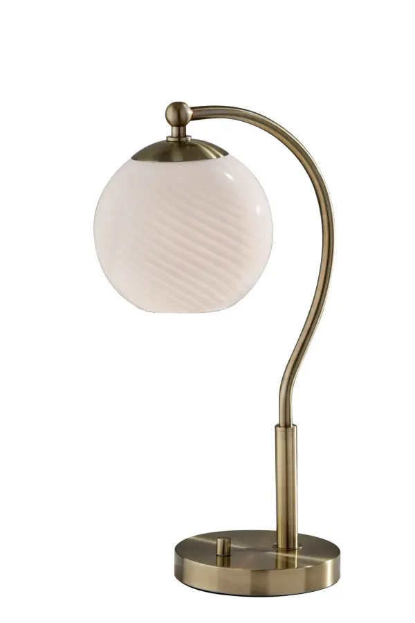 The Swirl Desk Lamp combines artistic swirled opal glass with warm antique brass for a sophisticated lighting solution. Its compact globe shade delivers soft, diffused light perfect for task or ambient lighting in home offices and bedrooms.