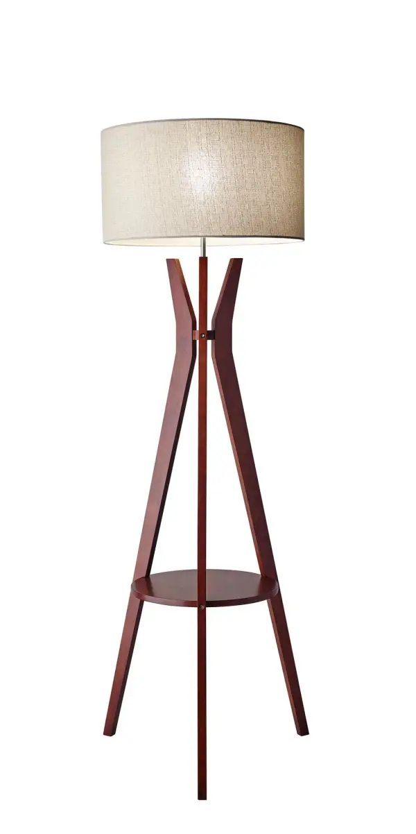 The Bedford combines rustic warmth with modern design through its solid walnut tripod base and oatmeal linen shade. The integrated 14-inch round shelf adds practical storage, making it ideal for small spaces needing both lighting and surface area.